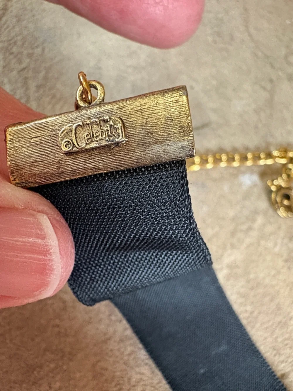 Celebrity black velvet choker with gold tone rose accent